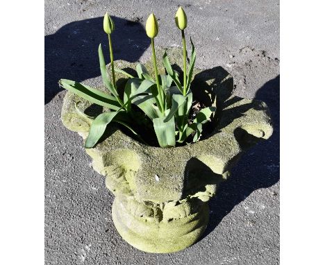 A reconstituted Corinthian column capital currently used as a garden planter, height 48cm.
