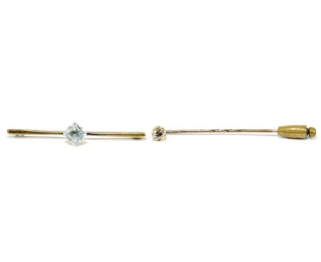 A yellow metal stick pin set with a diamond weighing approx. 0.40cts, length approx. 6.5cm, and a 9ct yellow gold bar brooch 