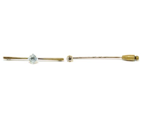 A yellow metal stick pin set with a diamond weighing approx. 0.40cts, length approx. 6.5cm, and a 9ct yellow gold bar brooch 