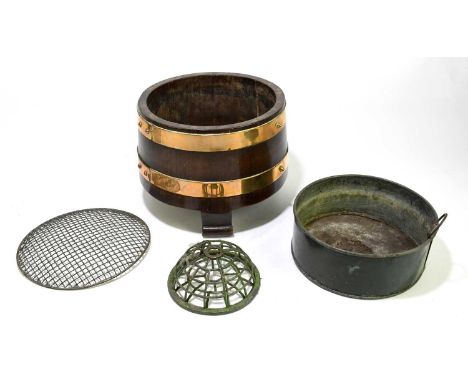 A brass bound oak planter of circular form, with later metal posy holder, diameter 24cm.