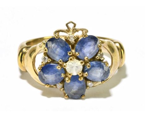 A 9ct yellow gold diamond and pale blue stone floral dress ring, size M, approx. 4.4g. 