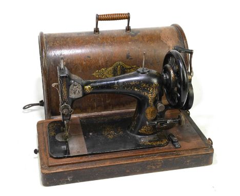 SINGER; a manual sewing machine, cased.
