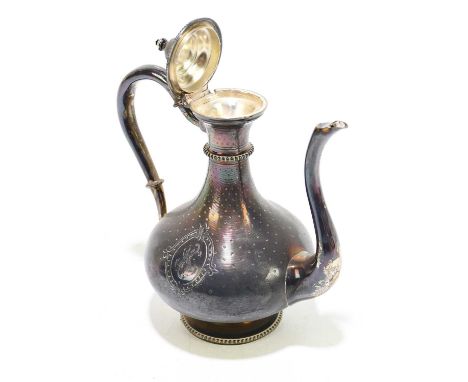A 19th century white metal oil ewer decorated with two cartouches initialled 'K', approx. 5.5ozt/177g, height 14cm.