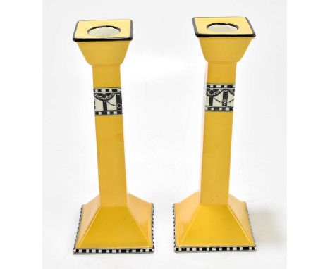 CARLTONWARE; a pair of candlesticks, height 26cm.