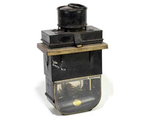 R THORLEY, GRAY'S INN, LONDON; a late 19th century black and brass signal lamp, possibly a railway lamp, with oval brass plat