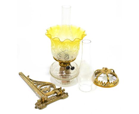 A Victorian wall mounted oil lamp with brass frame and yellow and frosted glass shade.Condition Report: Shade with light wear