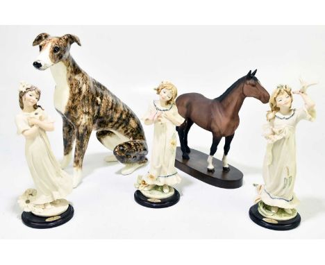 WINSTANLEY; a model of a seated dog, height 32cm, a Beswick horse on oval plinth base, and three Guiseppe Armani figures (5) 