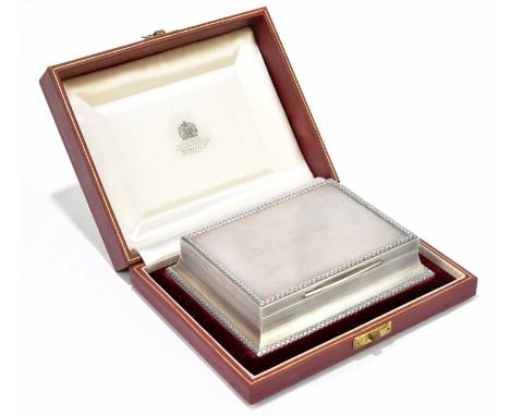 ASPREY &amp; CO; an Elizabeth II hallmarked silver cigarette box of shaped rectangular form, with cast rim and engine turned 