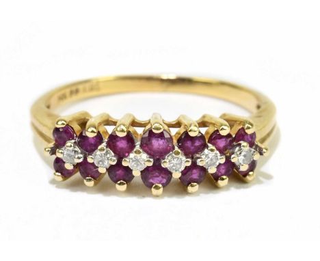 A 14ct yellow gold diamond and ruby ring, size N, approx. 2.8g. 