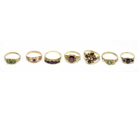 Six 9ct gold gem set rings, including two garnet examples, gross weight 13.3g, with a yellow metal gem set ring. (7)