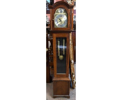 A reproduction mahogany cased longcase clock of small proportions with brass face and silvered chapter ring with both Arabic 