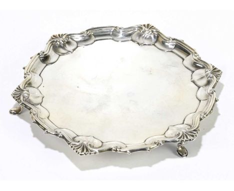 WILLIAM HUTTON &amp; SONS; an Edwardian hallmarked silver waiter, with shell and scroll border, Sheffield 1905, diameter over