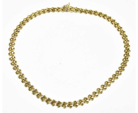 A flat link yellow metal necklace stamped '14k', length approx. 44cm, approx. 20g. 