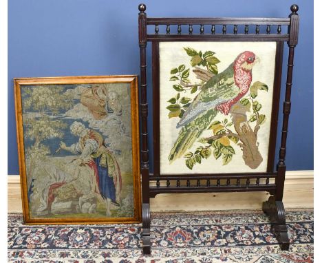 A 19th century stained walnut framed fire screen, the centre decorated with a needlework tapestry of a parrot perching, with 