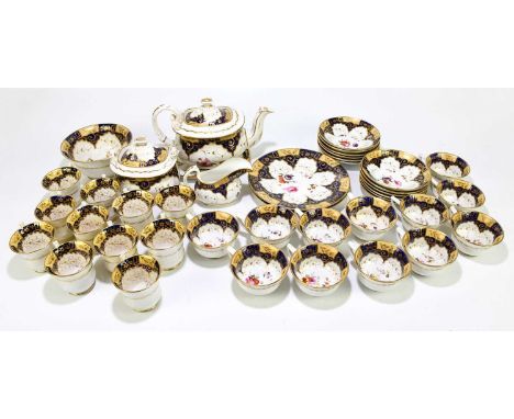 A 19th century matched twenty-nine piece tea service to include a teapot and stand, a lidded sugar bowl, a slop bowl, a milk 