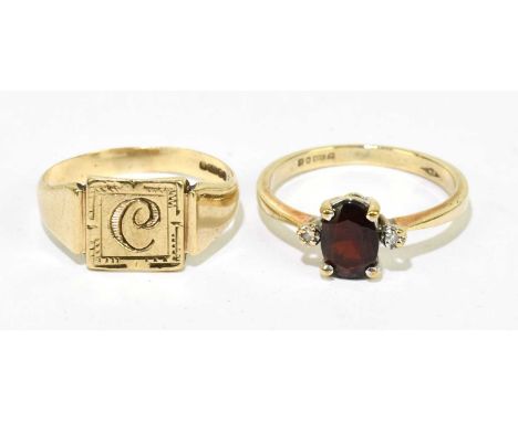 A 9ct gold signet ring engraved with initial 'C' to the rectangular platform, size L, and a 9ct garnet ring, size K, combined