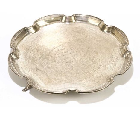 WILLIAM NEALE LTD; a George VI hallmarked silver salver with piecrust edge, with presentation inscription, Birmingham 1937, a