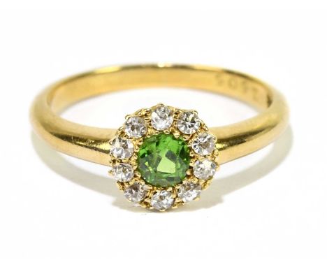 An 18ct yellow gold diamond and peridot floral cluster ring, size K, approx. 2.8g. 