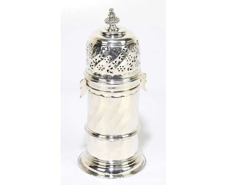 CHARLES STUART HARRIS; a late Victorian Britannia silver sugar caster of circular form with locking top and panelled decorati