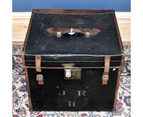 A late 19th century black leather steamer trunk with embossed leather finish, brown leather edges and corners and handle and 