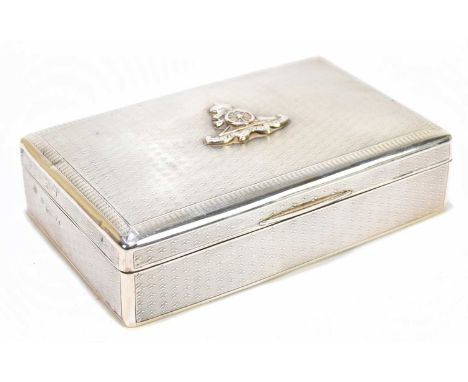 GOLDSMITHS &amp; SILVERSMITHS COMPANY LTD; a George V hallmarked silver cigarette case of rectangular form, with cedarwood li
