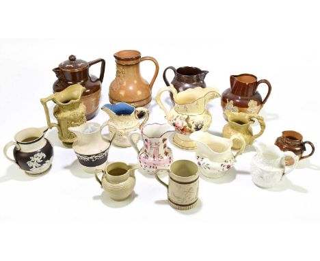 A collection of twenty-four early 19th century and later ceramic jugs, including a Doulton Lambeth stoneware 'Fill What You W
