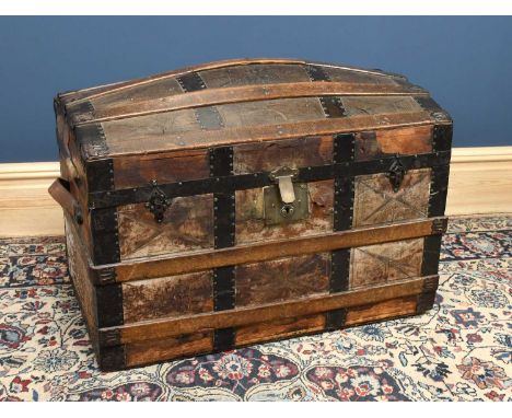 A late 19th century metal and wood bound domed travelling trunk, height 56cm, length 81cm.