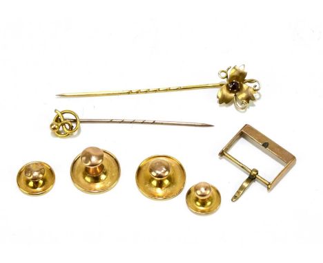 A Victorian yellow metal stick pin, set with ruby coloured stone, length 6cm, together with a further stick pin, four 9ct gol