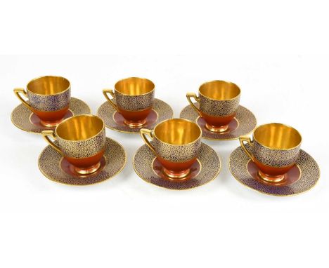 CARLTONWARE; a set of six Art Deco coffee cans and saucers, with gilt decoration.