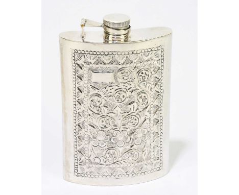 An Indian white metal hip flask of curved form relief decorated with stylised motifs stamped silver, height 14 cm, approx wei