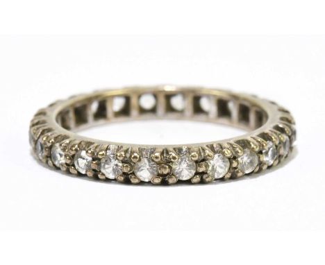 A 9ct yellow gold white stone set full eternity ring, size O 1/2, approx. 3.3g.