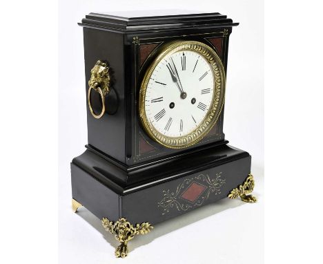 A Victorian slate and marble mantel clock, with gilt metal mounts and highlights surrounding the circular enamel dial set wit