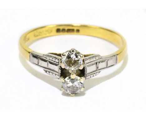 An 18ct yellow gold and twin stone diamond ring, each round brilliant cut stone weighing approx. 0.15cts, in six claw setting