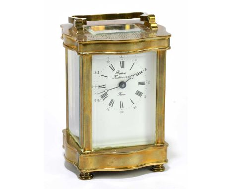 RAPPORT; a French brass cased carriage clock, the enamelled dial set with Arabic and Roman numerals, height including swing h