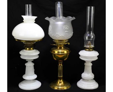 Two opaque glass oil lamps, one with opaque glass shade, tallest 49cm, with a brass oil lamp with moulded shade (3)