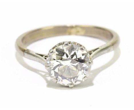A white metal diamond solitaire ring, the eight claw set old cut diamond weighing approx. 1.70cts, size M, approx. 3.6g. 