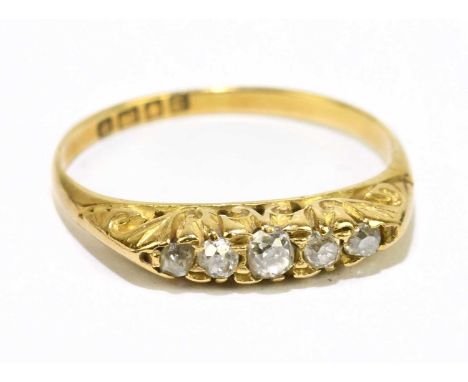 An 18ct yellow gold and old cut diamond graduated five stone ring, size M, approx. 2.4g.