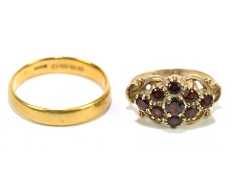 A 22ct yellow gold wedding band, size Q 1/2, approx. 4.2g, and a 9ct gold dress ring set with nine amber coloured stones, siz