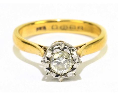 A 22ct yellow gold diamond solitaire ring, the illusion set round brilliant cut stone approx. 0.10cts, in high claw setting, 