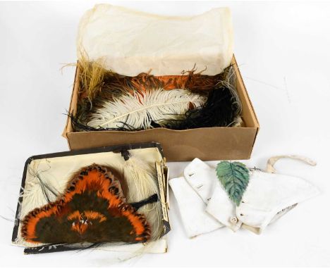 A collection of early 20th century millinery feathers and hair pieces including ostrich feathers in a variety of colours and 