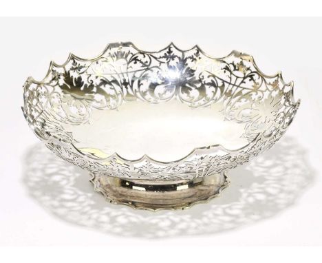 MOSLEY & CO; a George V hallmarked and pierced silver pedestal bowl, with shaped rim and foliate detailing, Sheffield 1931, w