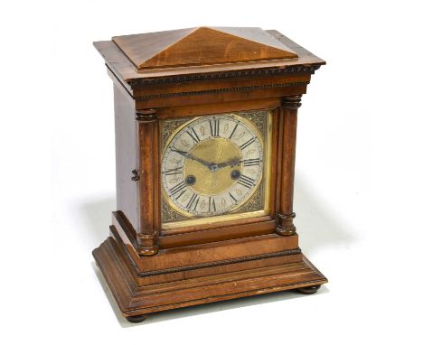 A late Victorian walnut eight day mantel clock, with silvered Roman numeral chapter ring and movement striking on a gong, hei
