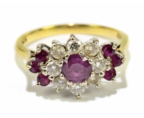 An 18ct yellow gold ruby and diamond stepped floral ring, size P, approx. 5.3g.