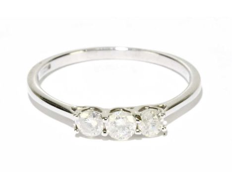 A 9ct white gold three stone diamond ring, size R, approx. 1.9g. 