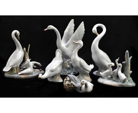 LLADRO; a group of a duck and four ducklings, length 10cm, with five Nao bird groups and a further Spanish bird group (7).Con