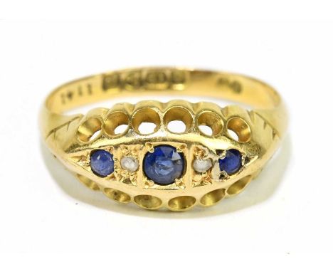 An 18ct yellow gold sapphire and diamond small five stone graduated ring, size J 1/2, approx. 2g. 