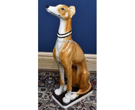 A large ceramic model of a seated lurcher, height 92 cm.