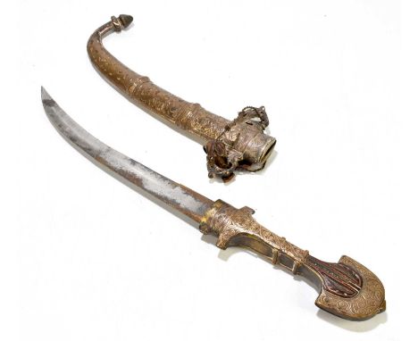 An Eastern brass and white metal jambiya, with scabbard, overall length 42cm. 