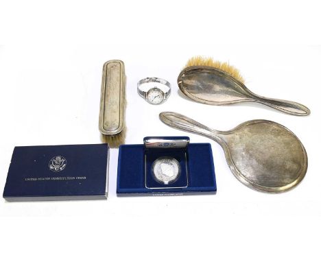 SYNYER &amp; BEDDOES; a George V hallmarked silver backed three piece dressing table set, comprising mirror, hair brush, hand
