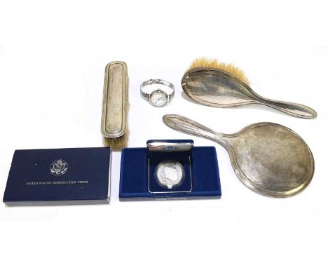 SYNYER &amp; BEDDOES; a George V hallmarked silver backed three piece dressing table set, comprising mirror, hair brush, hand